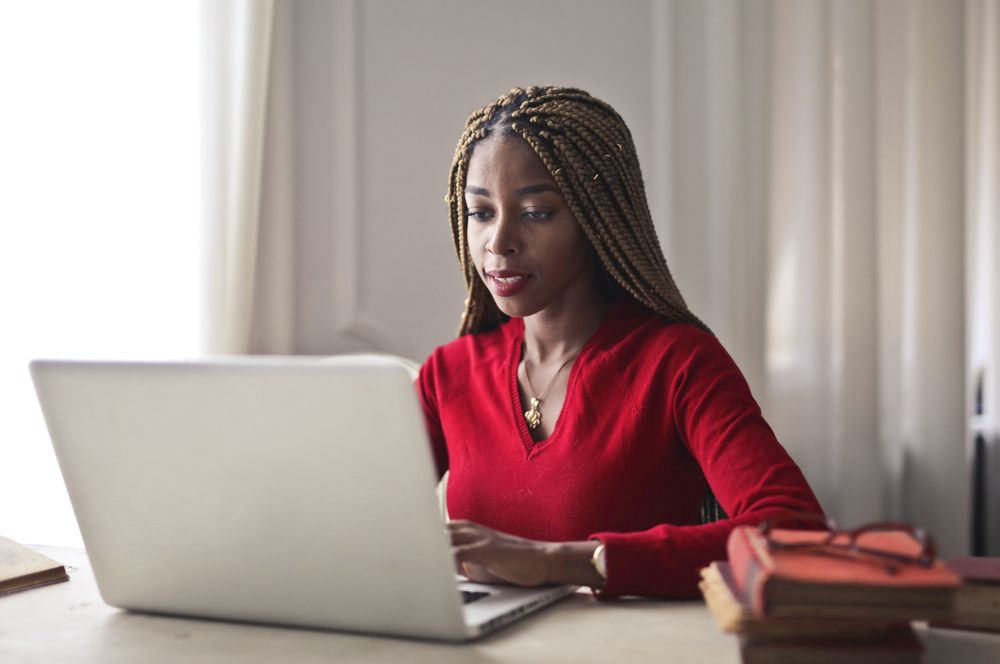 A Venmiga team member working on a laptop